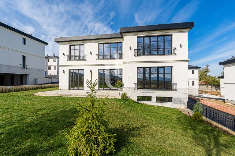 New house in classic style surrounded by gorgeous nature